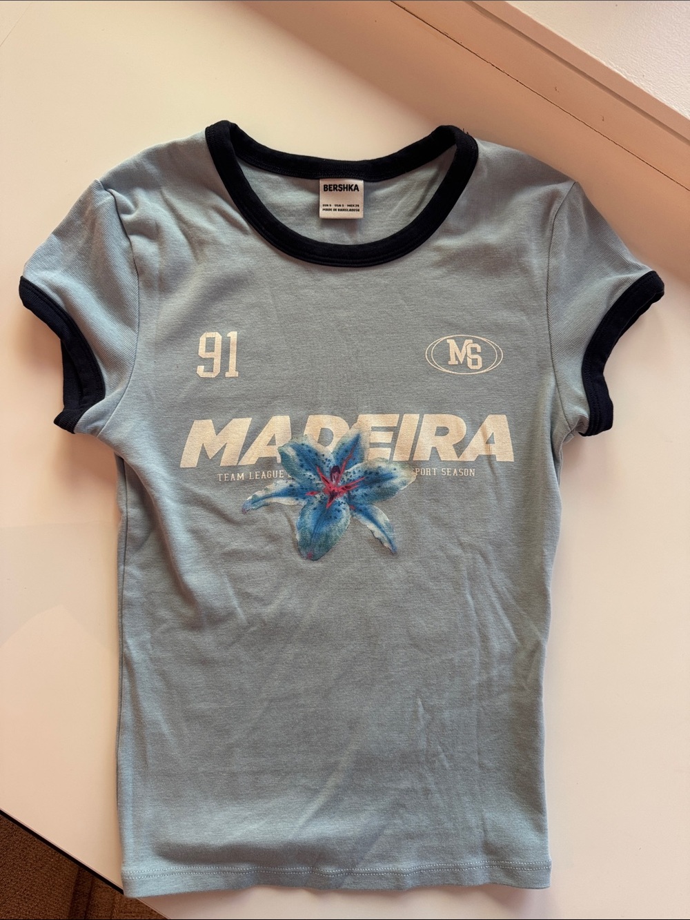 Bershka Light Blue Ringer Tee with Navy Trim and Floral Graphic